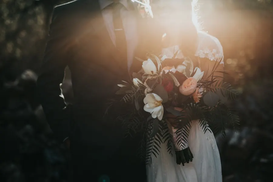 Sophia on her wedding day — soft chignon with delicate florals